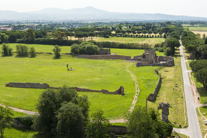 A view of Rome's Appia Antica Archaeological Park, with wide green lawns and trees