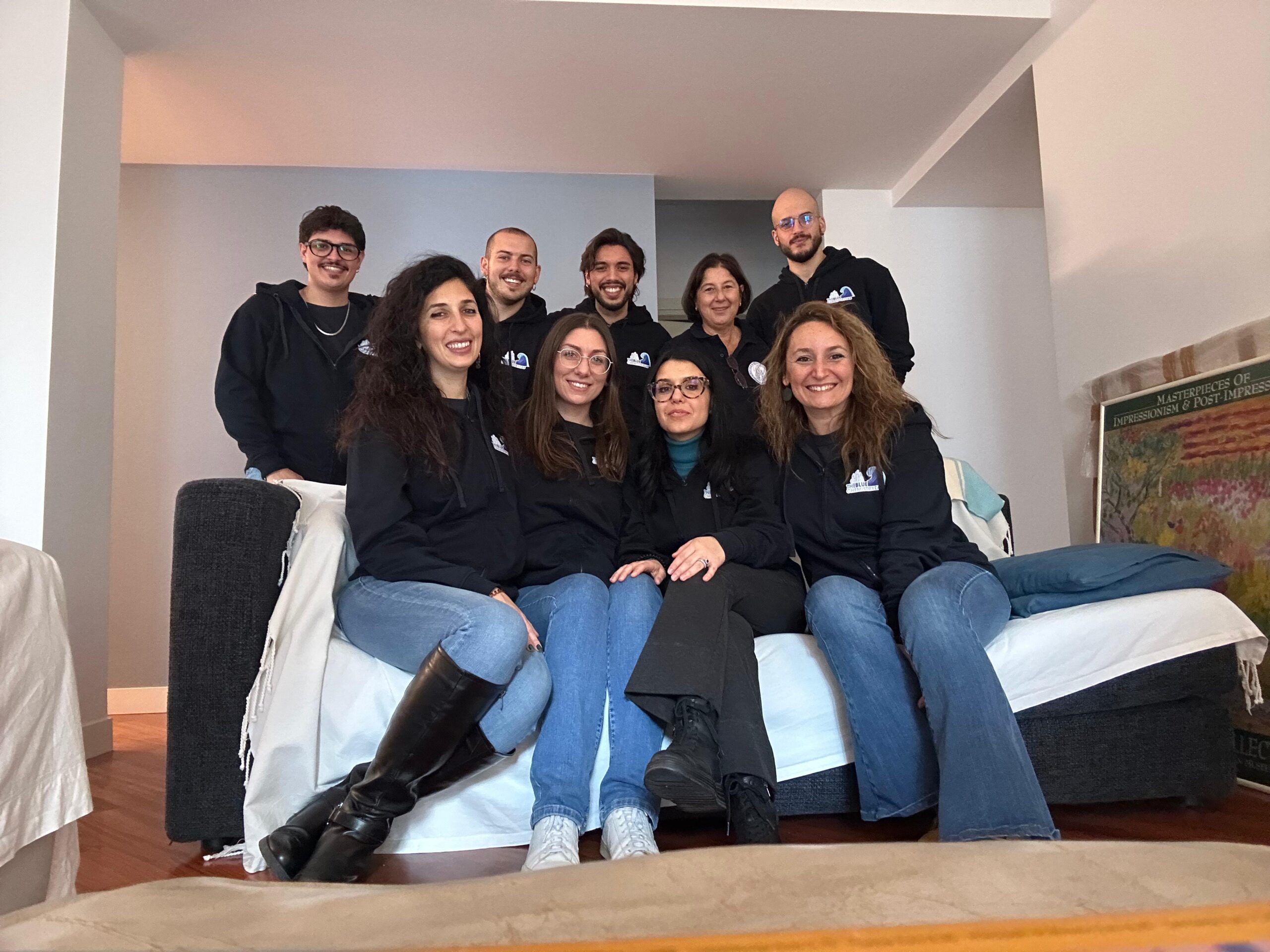 Young scientists pose smiling for a group photo